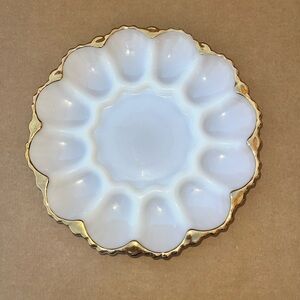 Vintage Anchor Hocking Fire-King milk glass deviled egg plate with gold trim.